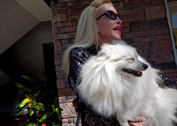 woman holding her Pomeranian, Palm Beach 2014